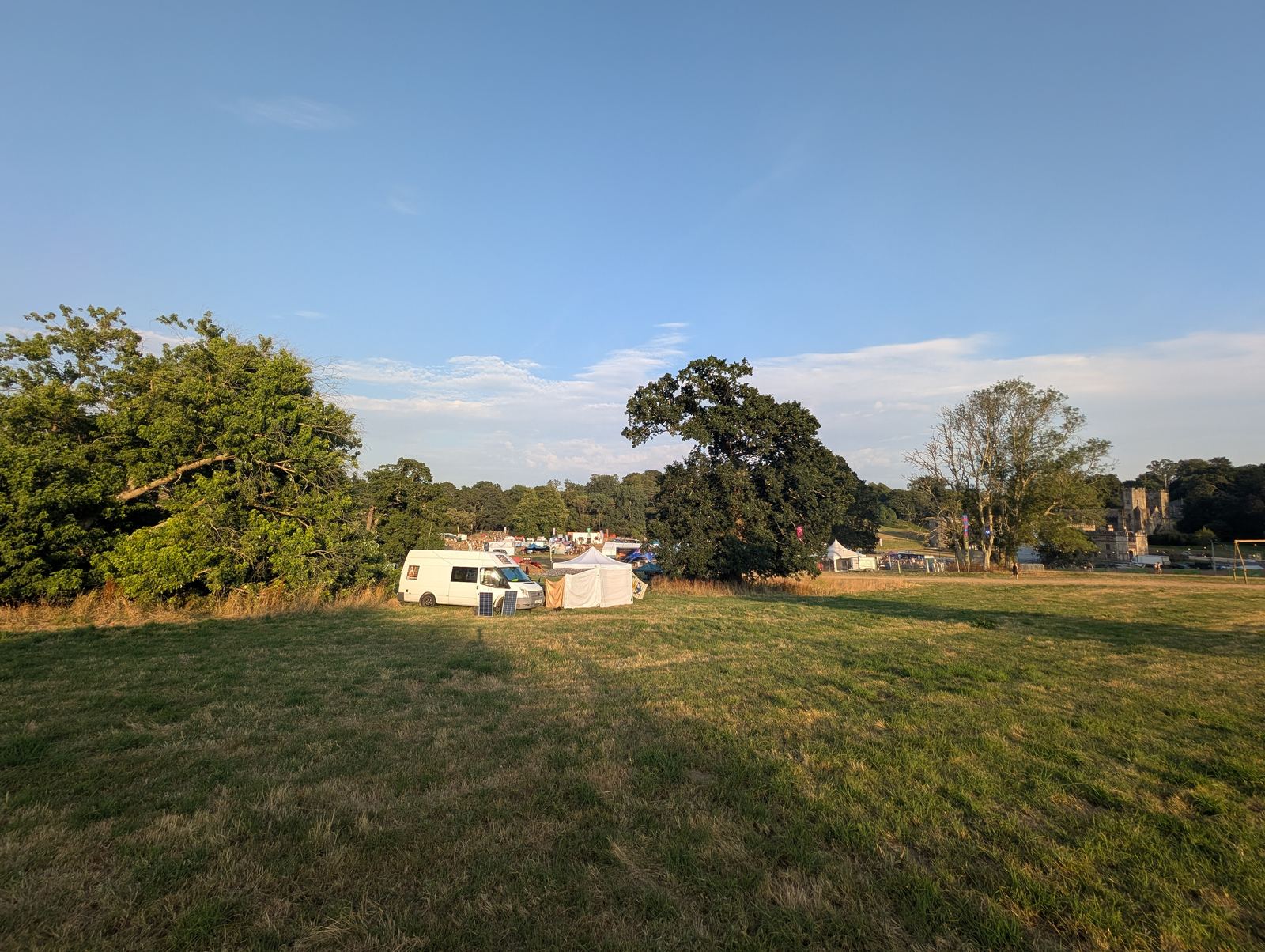 The Chillspace gazebo and van, solar panel visible, set up in a festival field
